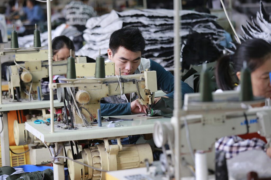 Photo of a Chinese worker in an apparel factory